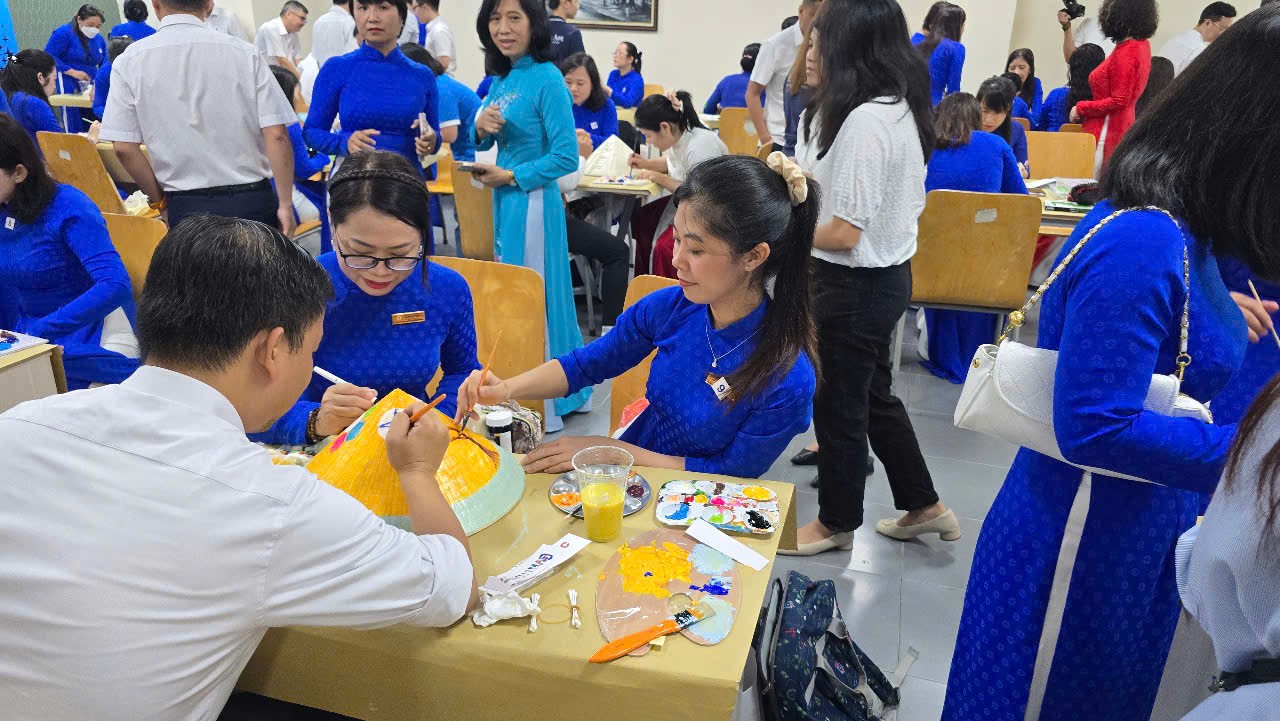 Guests painting conical hats in Saigon