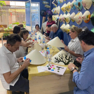 Travel group conical hat workshop in Saigon