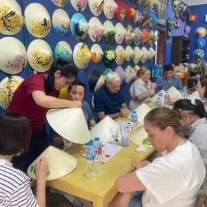 Travel group conical hat workshop in Saigon