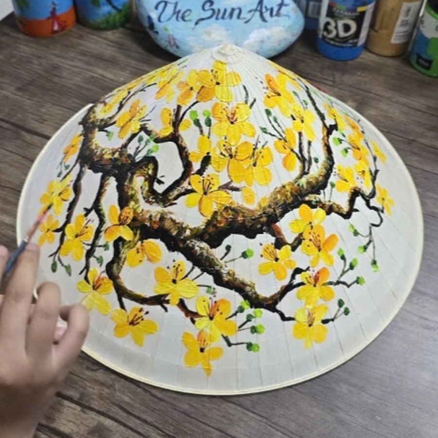 Hand-painted conical hat with yellow apricot blossoms (hoa mai), a Tet theme